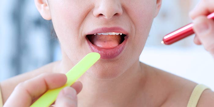 Проявление рака желудка в полости рта